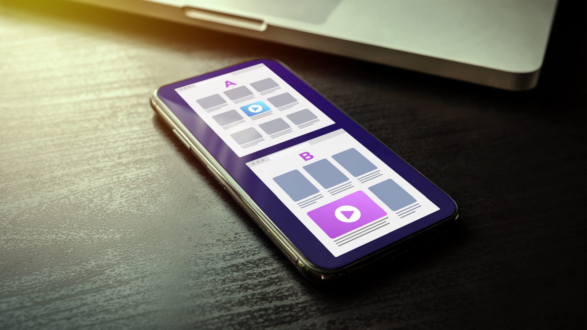 Mobile phone on a desk showing user interface variations for A/B testing 